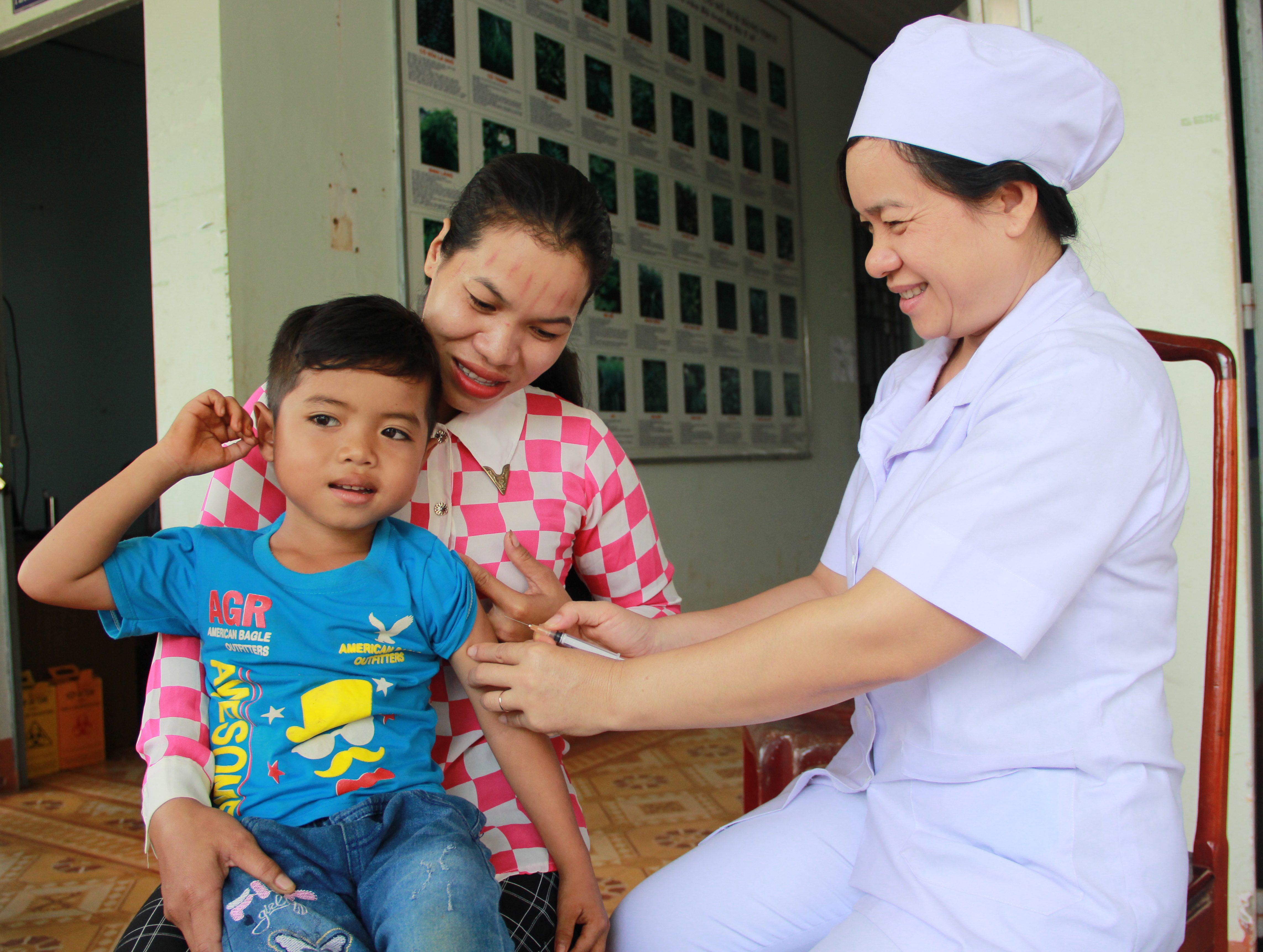 child receiving vaccine in Binh Phuoc province, Vietnam