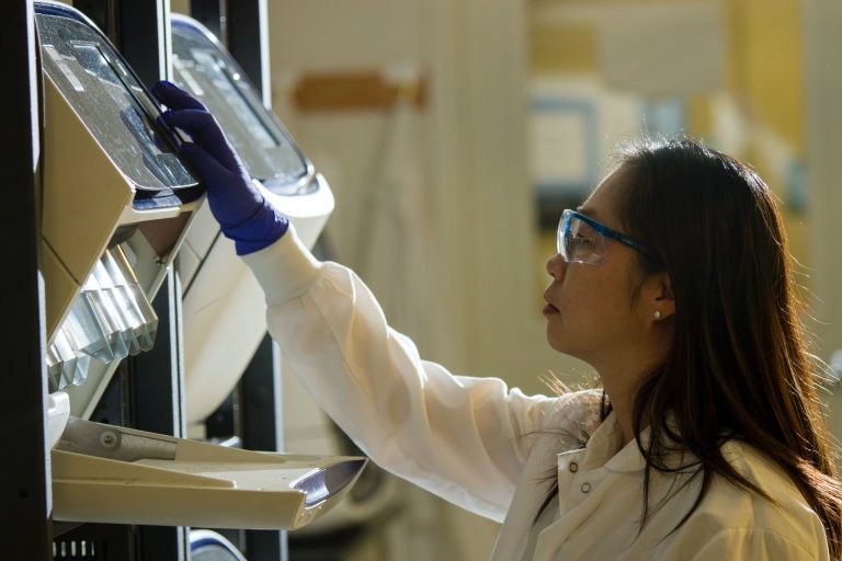 Technician prepares for a viral whole-genome sequencing experiment at the Cancer Genomics Research Laboratory.