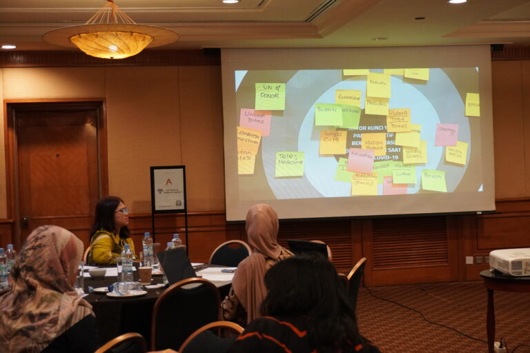 Public health professionals and community leaders discussing trusted voices in health communication as part of OUCRU Indonesia’s engagement project.